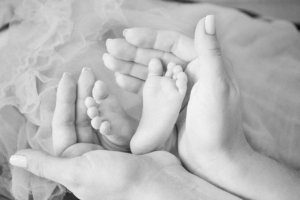 newborn baby hands mom